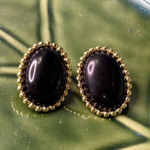 Vintage Monet Gold Tone Oval Clip On Earrings Polished Black Stone Signed Monet